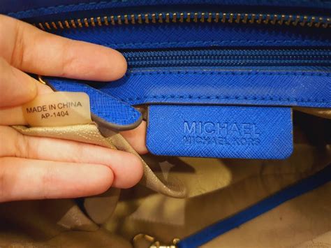 real vs fake michael kors zipper|michael kors purses serial number.